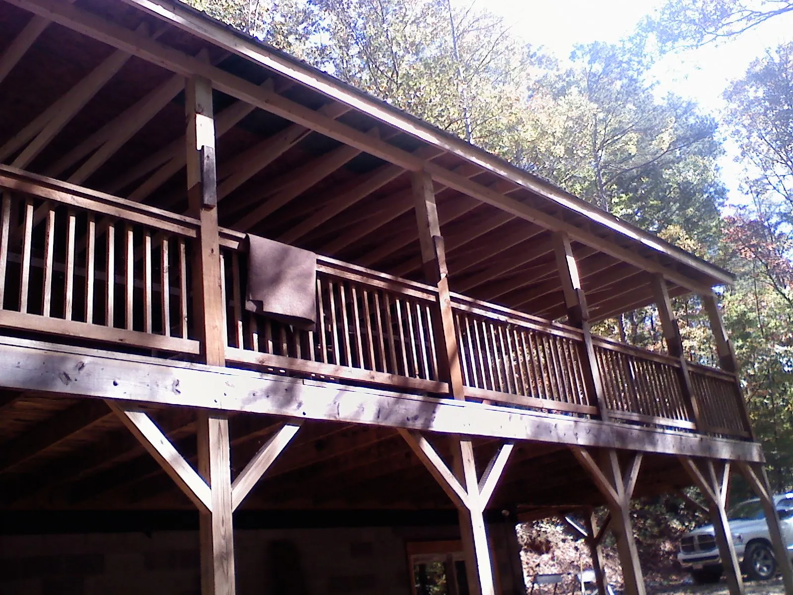 Timber framing under a new elevated porch and deck — Roof Leak Repair in Utica by Roofing Brothers